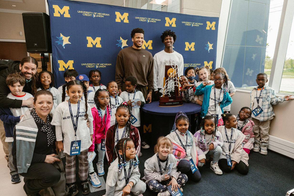 Trey McKenney and L.J. Cason pose with guests at the Grand Opening event on May 13th.