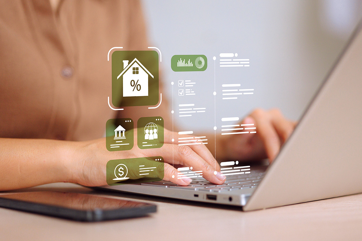 icons hovering in space over hands seated at a laptop